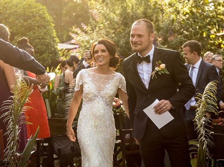 Jill and her husband Ty on their wedding day